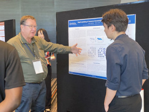 John Anderson discussing Student Posters